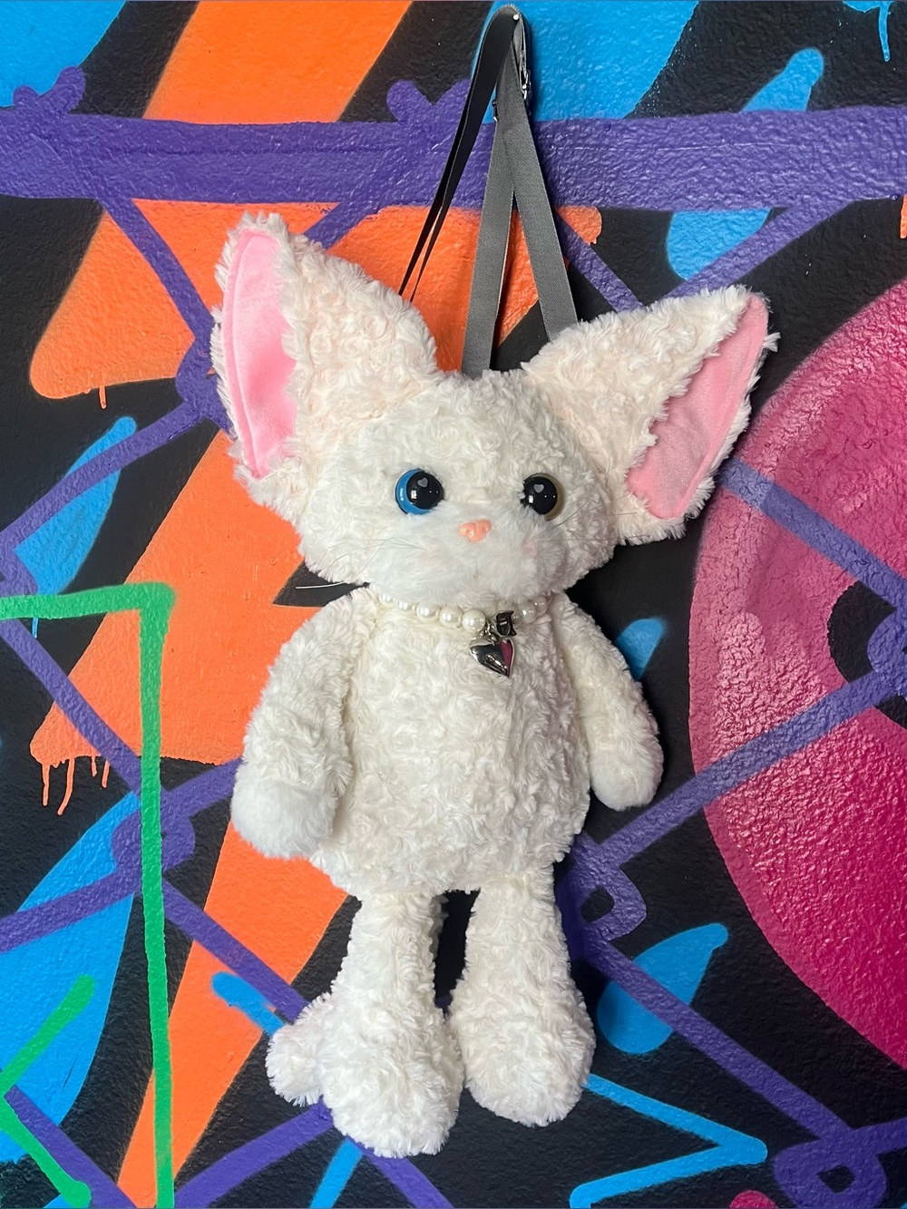 White plush floppy eared cat backpack